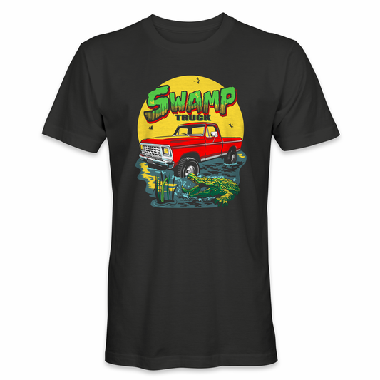 A black t-shirt with a swamp truck design featuring a Ford F100 truck in a swamp with a gator and a logo of a gator’s head. Swamp truck t-shirt in black color with a classic Ford F100 truck sitting in a swamp with a gator and a Swamp Truck title. A t-shirt design of a gator trying to bite a Ford F100 truck in a swamp with a Swamp Truck title and logo in white color.